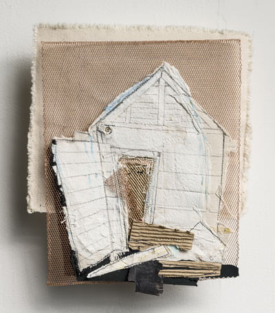 Textile artwork that looks like a house