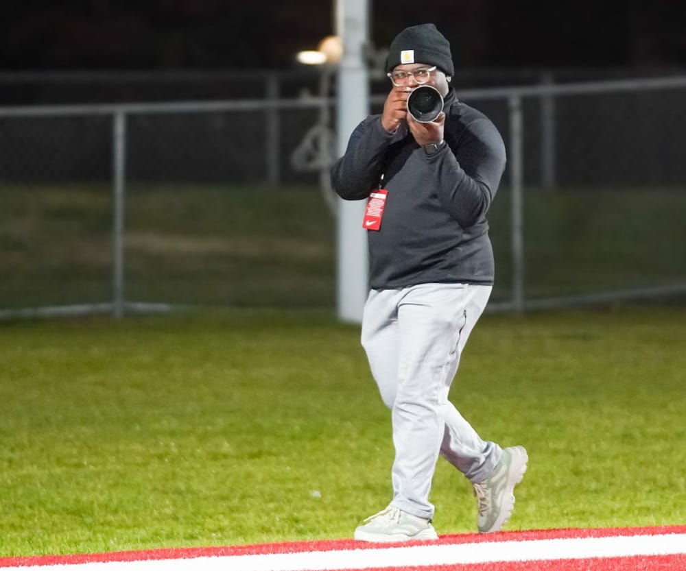 Johnson shares perspective of student life behind the camera lens 1 Student Amiel Johnson pointing a camera at a subject.