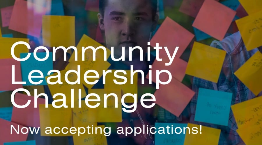 CLC_25w Wall with stickies covering it and words Community Leadership Challenge.