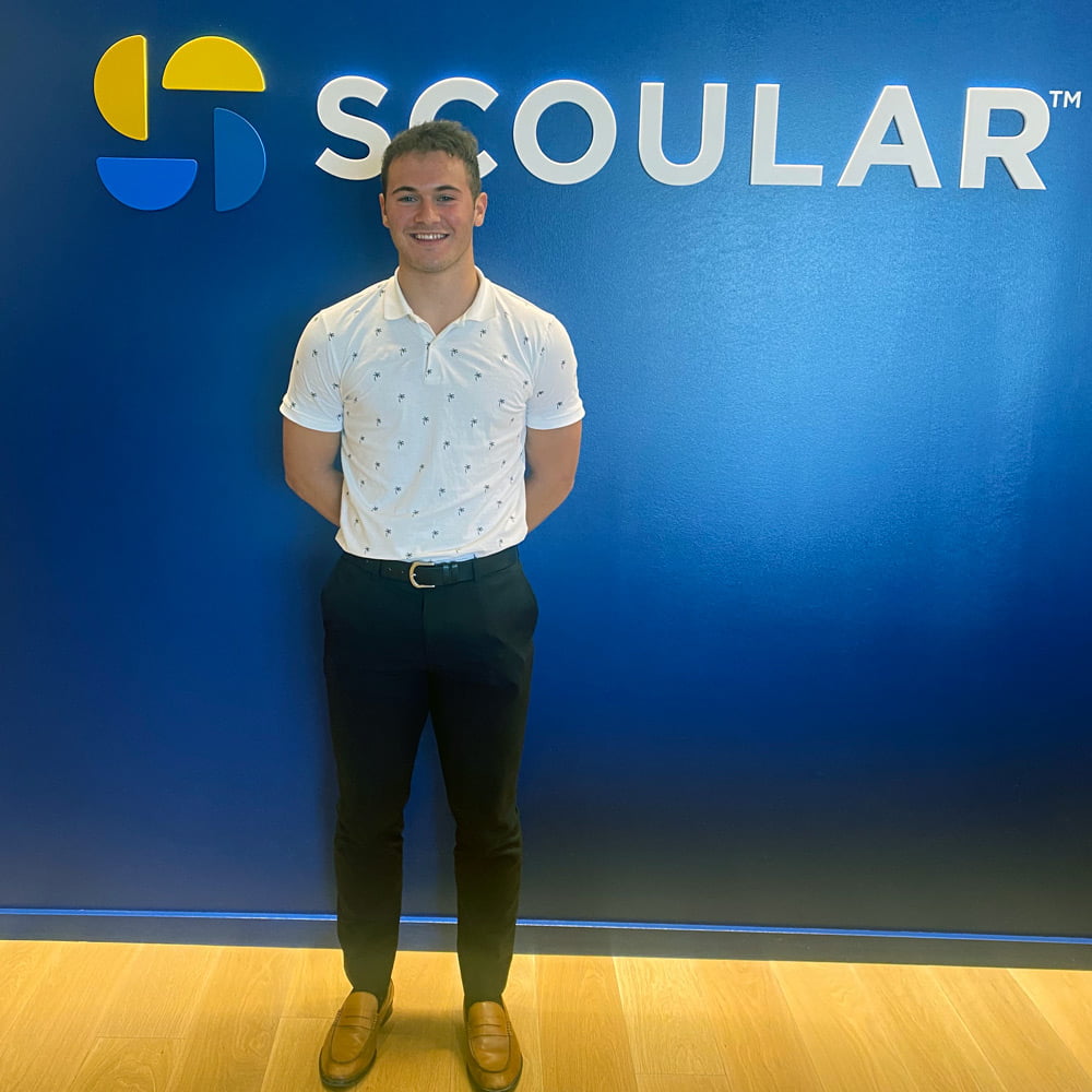 Hastings College student Caden Egr is gaining coding experience during an internship with Scoular at its global headquarters in Omaha.