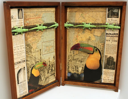 An art box with newspaper clippings and other materials