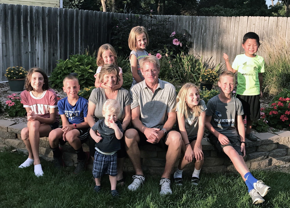 A photo of Doug and Diane Phelps and their grandchildren.