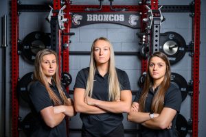 Photo of Cassidy Dyhrkopp, Ally Ginkens and Shandra Farmer, who are members of the Hastings College Human Performance staff.