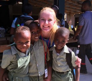 Emma Johnson with children in Haiti