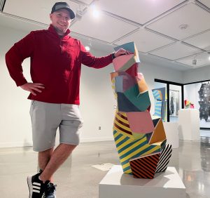 Garet Reynek '10 in the gallery at the Jackson Dinsdale Art Center.