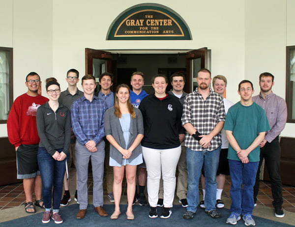 A posed picture of two rows of students.