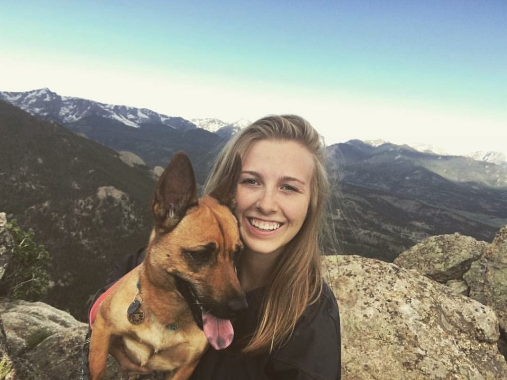 Photo of a woman and her dog near Estes Park, Colorado. 