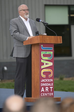 Photo of Tom Kreager speaking at a podium