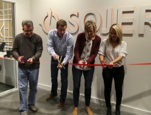 Photo of Brent Brummer cutting the ribbon at Sojern headquarters in Omaha.