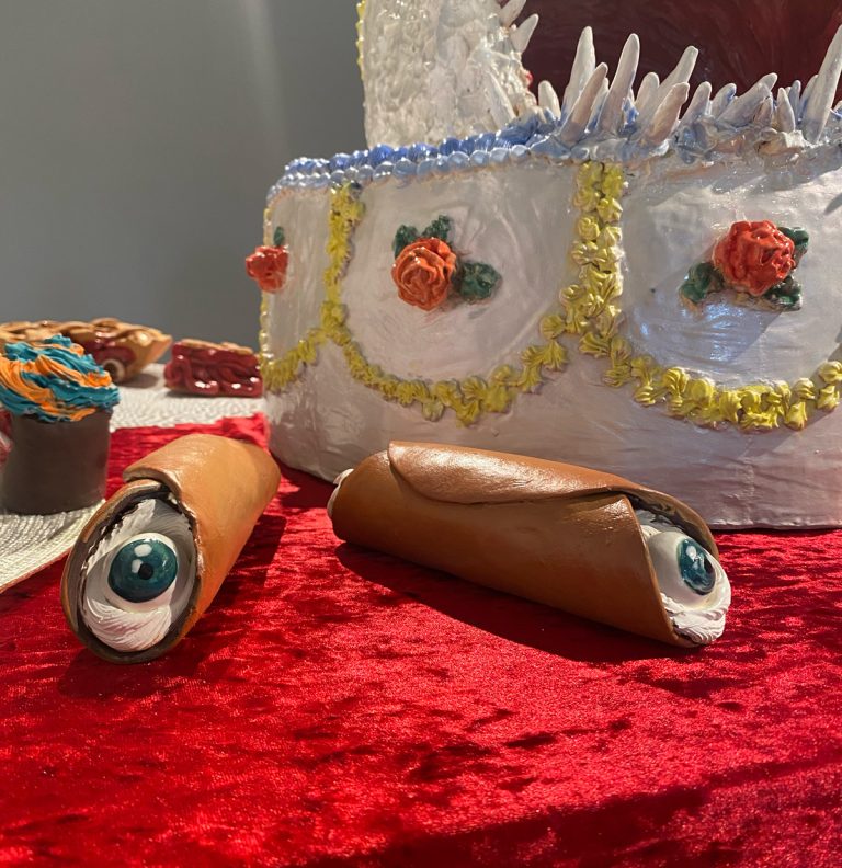 News 9 This piece of art features clay cannoli with eyeballs.