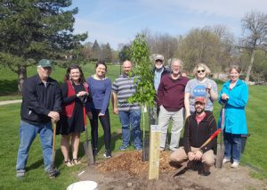 News 12 Students, faculty and staff with the Northern Red Oak tree they planted.