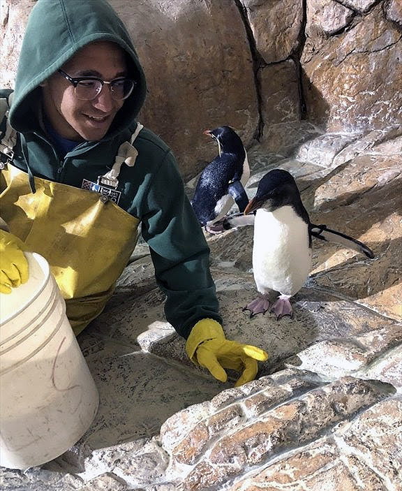 Student with a penguin. 