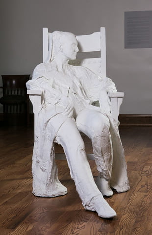 Photo of artwork by George Segal, Woman in Armchair.