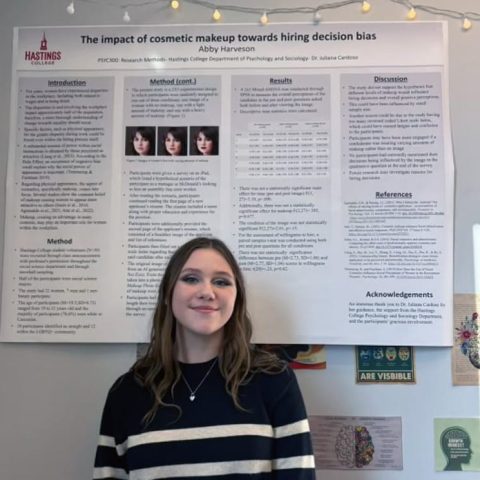 Abby Harveson and her poster Academic Showcase Day at Hastings College.