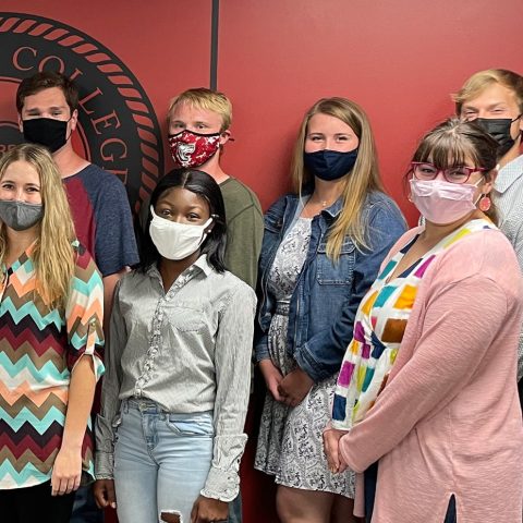 New members of Alpha Chi include (front, from left): Emma Severson, Kianté Stuart, Jocelyn Polacek and (back, from left) Logan McCullough, Matheson Baird, Shelby Banks and Kinser Rafert.