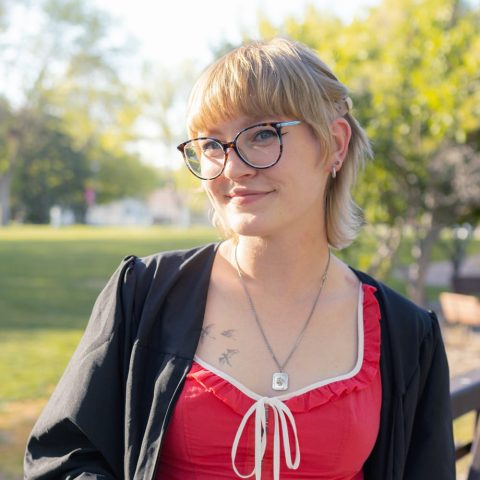 Anna Bultman in her graduation gown on the campus just before she graduated in May 2025. (Photo by Madison Bredemeier)