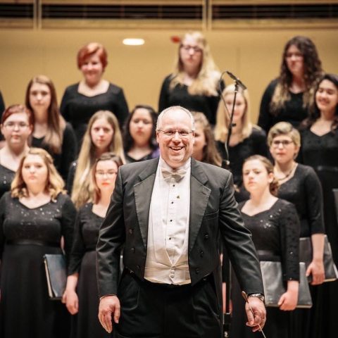 Brad Ronne ’93 with the Scottsbluff Choir performing at Chicago Symphony Hall.