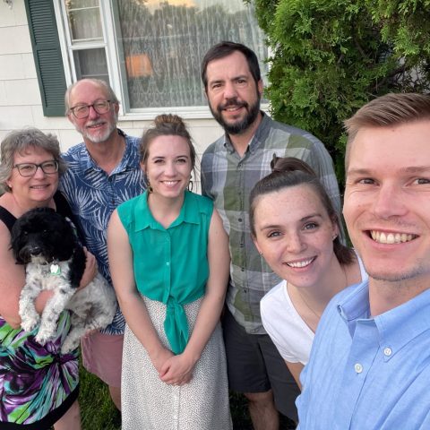Family photo: Picture, from left, Deb, who is holding Jude, and Dr. Byron Jensen, Hannah ‘15 and Rev. Damen Jensen-Heitmann, Anna Griggs ‘17 and Nathan Jensen ‘18.