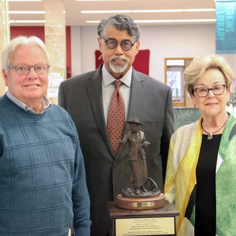 Rev. Jimmy Shelbourn and his spouse Carol donated the Willa Cather bronze to Hastings College on April 25. They are shown here with the statue’s artist, Littleton Alston (center).