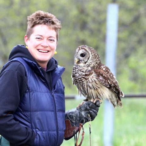 Devin Jaffe '09 and her barred owl, Wicket, educate audiences about wildlife and conservation. (Photo by Julie Bender.)