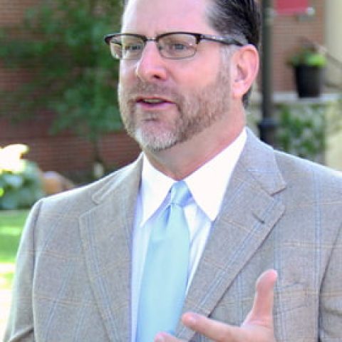 Photo of Travis Feezell outside.