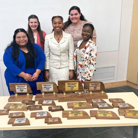Hastings College forensics team members and the hardware they earned at the NIFA last week. From left, Citlaly Quiroz, Emma Kellick, Ally Banks, Nikki deSeriere and Kianté Stuart.