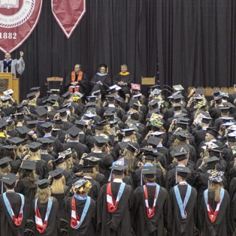 Photo of graduating students in an arena.