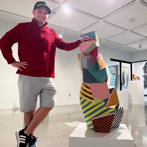 Garet Reynek '10 in the gallery at the Jackson Dinsdale Art Center.