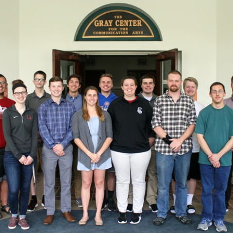 A posed picture of two rows of students.