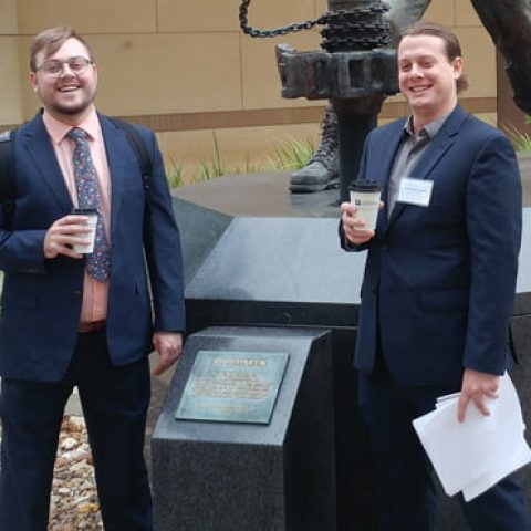 Photo of James Lapka and Austin Heinlein outside.