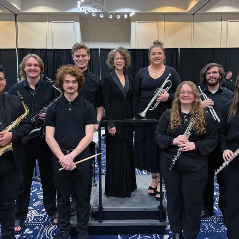 Hastings College students participating in the 2025 Intercollegiate Band include (from left) Erick Rodriguez, Karl Ludwig, Jason Jones, David Udlock, director Dr. Emily Threinen, Mekenzie Miller, Maggie deFreese, Daniel Steinhauser and Anna Zentz.