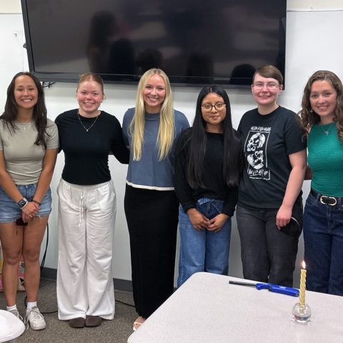Newly initiated members (from left) Lily Sporleder, Victoria Mallory, Lisa Hoeflich and Caitlin Bolton, stand alongside chapter officers Gianna Lucas, Ember Thoreson, Alyssa Currie and Victoria Harris.