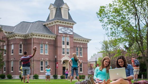 LandThumb_StudentLife5 Students sitting in front of McCormick Hall