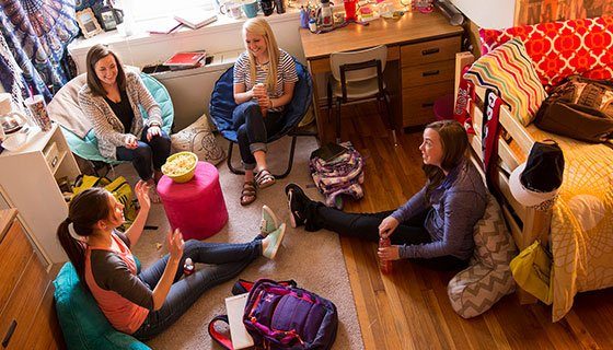 Students hanging out in a Taylor Hall dorm room