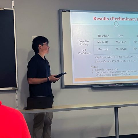 Michael Medina presenting his research during Academic Showcase.