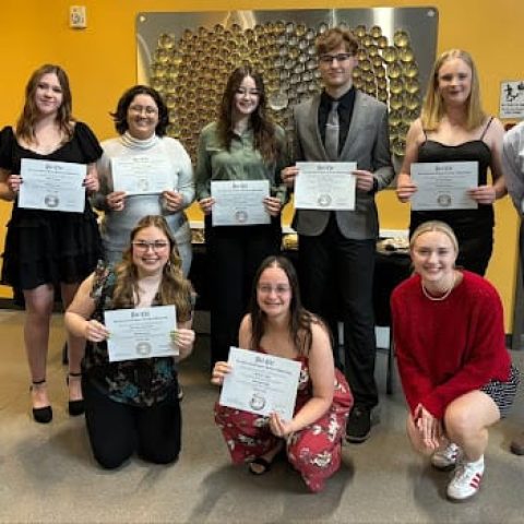 New members of the Hastings College chapter of Psi Chi were inducted recently and are shown holding certificates. In the photo are (front, from left) Chloe Blumanthal, Hailey Vigil and Riley Lanning, co-president; and (back, from left) Dr. Juliana Cardoso, assistant professor of psychology and sponsor of Psi Chi; Abby Harveson, Isis Abou El Ghiet, Anna Zentz, Levi West, Kya Shatzer and Isaiah Strachan, co-president. Other inductees not pictured are Lauren Buscher, Millie Gell, Lilac Ramsey and Dacey Sealey.