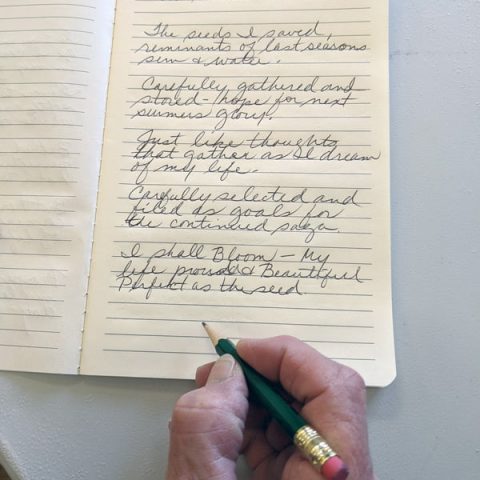 A participant in the writing workshop drafts a poem entitled "Who Should Blossom?"