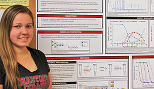 Heidi Roth with her presentation poster