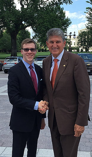 Nick Musgrave shakes hands with Senator Joe Manchin on Capitol Hill in Washington, D.C. Musgrave spent the summer in Manchin's office working as a press intern.