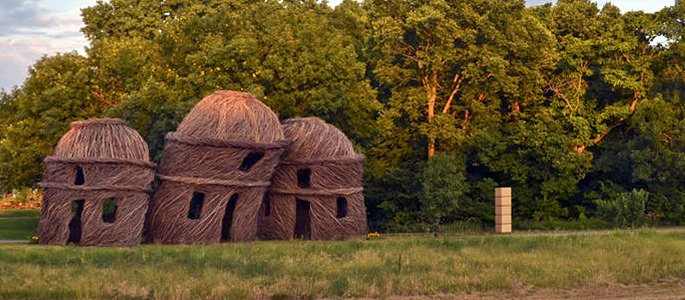 Hastings College art students helped Patrick Dougherty construct Three of a Kind